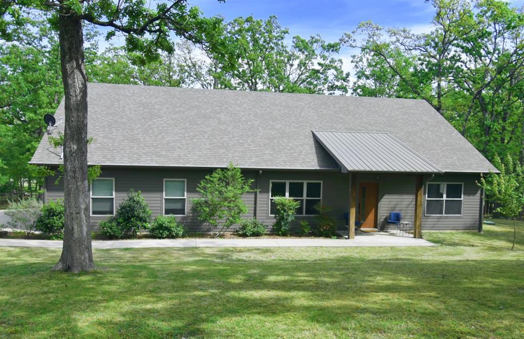 CUSTOM BUILT HOME on Legendary Lake Fork! Sitting in the Hills Point Subdivision on the shores of the Birch Creek area. This Lake Fork home features open kitchen, dining and living area, 3 bedrooms, 2 bathrooms, 7' x 10' front porch, 9' x 35' covered back porch with a hot tub. All concrete driveway and a 2 car garage, storage building and a pier at the lake with a solar panel system to keep your boat charged. Property has .49 acres deeded with sprinkler system on a heavily wooded lot plus leaseback on World Famous Lake Fork. This home is totally custom from the ground up! Granite counter tops and Luxury Vinyl Plank Flooring throughout the home. This home has been meticulously maintained by the original owners and is in like-new condition. Bring your best offer before its gone! Buyer to verify any and all information.
