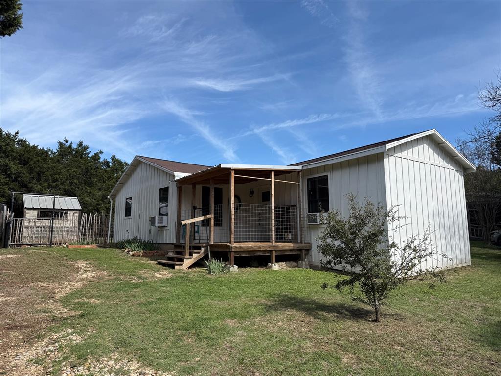 Agents love to say “over-the-top renovations,” but this home is one we can truly shout about. Add walking distance access to the serene sunset beaches of Lake Whitney, and you’ve discovered a genuine treasure. Renovated from the ground up in 2019, the home features updated wiring, plumbing, insulation, roofing, durable LVP flooring, and beautiful natural wood paneling that brings warmth and character to every room. The kitchen comes equipped with a gas range, dishwasher.  Utility room comes washer and dryer, making it fully move-in ready.
Whether you're downsizing, dreaming of a lake getaway, or searching for that perfect first home, the outdoor living spaces add exceptional value. The property includes two storage buildings, a hand-built greenhouse, loafing shed, clothes line and even an outdoor bath—ideal for gardeners, hobbyists, or anyone who loves spending time under big Texas skies.