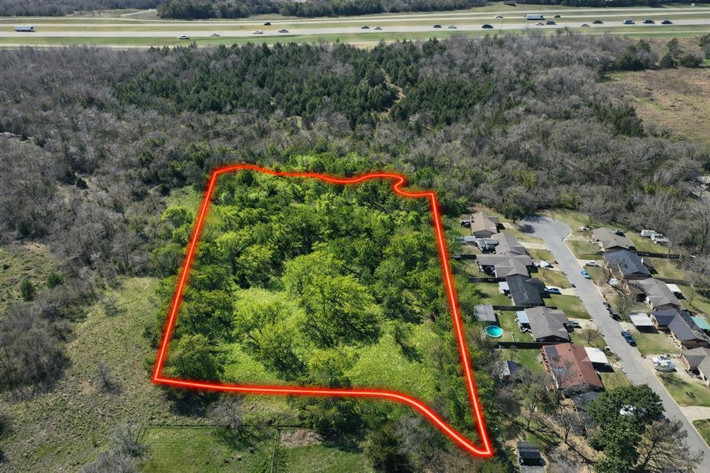 Prime Development Opportunity in Growing Denison! This 4.186-acre tract at 1805 Lynlee Lane offers exceptional potential in one of Denison’s fastest-expanding areas. With Lynlee Lane planned to extend into the future Creekview Addition, this property is strategically positioned for future residential development and long-term investment.
Surrounded by ongoing growth and new construction, this tract sits directly in the path of progress—making it an ideal opportunity for builders, developers, or investors looking to get ahead of the market. The property offers excellent accessibility while maintaining a sense of privacy and space.
The land is adorned with beautiful, mature trees that create a scenic, park-like environment—an increasingly rare feature that enhances both immediate enjoyment and future lot value and curb appeal. Whether preserved for a signature homesite or incorporated into a thoughtfully planned development, the natural landscape adds significant appeal. Highly desirable Hyde Park Elementary School is just down the street.
Conveniently located near Hwy 75, the property provides easy access to shopping, dining, schools, and major commuting routes, all while being tucked into a peaceful setting. With utilities nearby and infrastructure expansion on the horizon, this tract offers both practicality and vision.
Whether you're planning a residential development, a private estate, or holding for future appreciation, this property delivers location, beauty, and opportunity.
Don’t miss your chance to secure a premium piece of land with endless possibilities in the heart of Denison’s growth corridor.