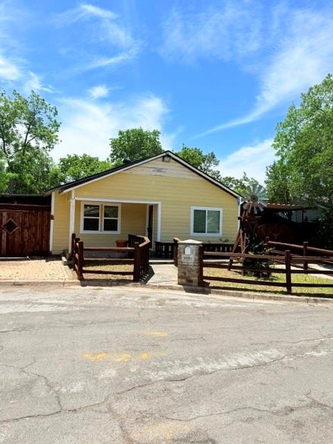 Bring your vision and unlock the potential of this charming starter home nestled in a well-established neighborhood. This property features 3 bedrooms, 1 bathroom, plus an ADDITIONAL 1-Bed 1-Bath studio-apartment offering extra living space or income potential. With a little TLC, this home could truly become something special. Major updates include a new roof installed in 2024 and an AC system that is only about 4 years old. The property also offers a spacious grassy backyard and a detached 4-car carport, providing plenty of parking and outdoor space. Conveniently located just minutes from downtown Fort Worth and with easy access to major highways, this home combines opportunity, location, and value. Home is being offered as-is.