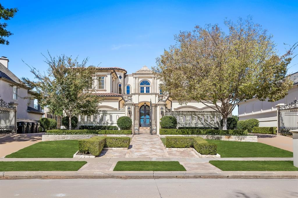 Exquisite 3-level Tuscan retreat in coveted Creeks of Willow Bend is meticulously updated, with circular drive guiding you to a beautiful interior lot with lake & greenbelt view. The elegant foyer welcomes with decorative ceilings, marble pillars, and polished travertine flooring. Stately formal living area has gas fireplace, elaborate custom ceiling, walls of arched windows, and access to formal dining room, kitchen, and winding staircase. Dining room boasts stylishly designed ceiling, stained-glass windows, and opulent chandelier, perfect for special occasions. 
Kitchen is a chef's dream, with a commercial-grade range, Sub-Zero refrigerator, Wolf appliances and electric fireplace. Ideal for entertaining, with 2 marble islands with seating, cozy breakfast nook, stained glass cabinetry, and patio access. Gorgeous study has beamed ceilings, rounded sitting area with windows, gas fireplace, and ornate iron cabinetry. The primary suite is a sanctuary, with stained-glass accented ceiling, walls of windows, doors to extended balcony, gas fireplace, and custom walk-in closet. Primary bath has arched doorways, with freestanding tub with jets, dual vanities, separate shower with body sprays, and steam feature. Upstairs has more amenities, like exercise room with balcony access, open living area, and laundry room with built-in pet shower that can also be an office. Secondary bedrooms all feature ensuite baths and walk-in closets and boast recessed ceilings and abundant natural lighting. Downstairs, the built-out basement features media room, temp-controlled wine cellar, and living area that can be converted to billiards room. The resort-style backyard is ideal for outdoor living, with built-in gas grill, 2-story infinity pool & spa, putting green, and space to lounge while enjoying views of greenbelt and lake. Additional features include whole-house generator and elevator, close to Gleneagles Country Club, and access to Dallas North Tollway and George Bush Tollway.