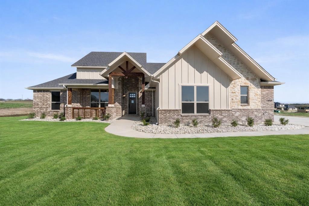 *SINGLE ACRE LOT SEEKING PICKUP TRUCK. MUST APPRECIATE OVERSIZED GARAGES, LOW TAXES, AND LONG WALKS PAST PERMITTED METAL SHOPS. BONUS POINTS IF YOU LOVE GIANT KITCHEN ISLANDS AND WOOD BURNING FIREPLACES*  Brand NEW construction home offering MORE HOUSE FOR YOUR MONEY and truly one of the BEST BANG-FOR-YOUR-BUCK NEW HOMES AVAILABLE. Situated on a ONE-ACRE TREE LINED LOT, this home delivers space, quality, and flexibility with OVERSIZED ROOMS and abundant windows for natural light. The living area features a FLOOR-TO-CEILING STACKED STONE WOOD-BURNING FIREPLACE as a stunning focal point. The kitchen includes CUSTOM KNOTTY ALDER SOFT-CLOSE CABINETRY, large island and generous storage. A DEDICATED OFFICE WITH CLOSET AND FRENCH DOORS offers flexibility and big enough to used as a BEDROOM IF DESIRED. The primary suite features DIRECT ACCESS TO THE LAUNDRY ROOM, along with LOTS OF CLOSET SPACE. Additional highlights include a MUDROOM, COVERED FRONT AND BACK PORCHES, PRIVATE TREE LINE IN BACK and an OVERSIZED THREE-CAR GARAGE WITH 8-FT DOORS. Enjoy NO CITY TAXES (1.5% tax rate), LOW HOA, and METAL SHOPS ALLOWED. Located in highly sought after Maypearl ISD and less than 10 mins from shopping, dining and everyday conveniences with quick access to both I-35E and I-35W for an easy commute anywhere in the metroplex. Estimated completion is October, giving buyers the rare opportunity to secure the home now and select many of their own colors and finishes. Photos are of the builder's completed homes in the neighborhood and are intended to represent quality, craftsmanship and design. More flexibility. More value — THIS HOME DELIVERS.