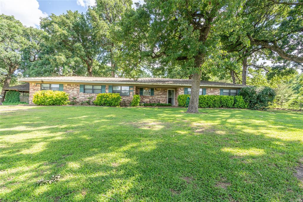 NEW PAINT !!! NEW FLOORING !!!! NEW PAINT ON KITCHEN CABINETS!!!! COUNTRY LIVING BEAUTIFUL 2 ACRE SHADED LOT.3 BEDROOM 2 BATH WITH 2 LIVING AREAS. 58' X 30' OVERSIZED SHOP WITH LOTS OF POSSIBILITIES! ONLY 15 MINUTESFROM THE LOOP. LIVING ROOM WITH FIREPLACE THAT HAS WOOD BURNING INSERT. KITCHEN WITH PANTRY AND LOTSOF CABINETS. METAL ROOF
