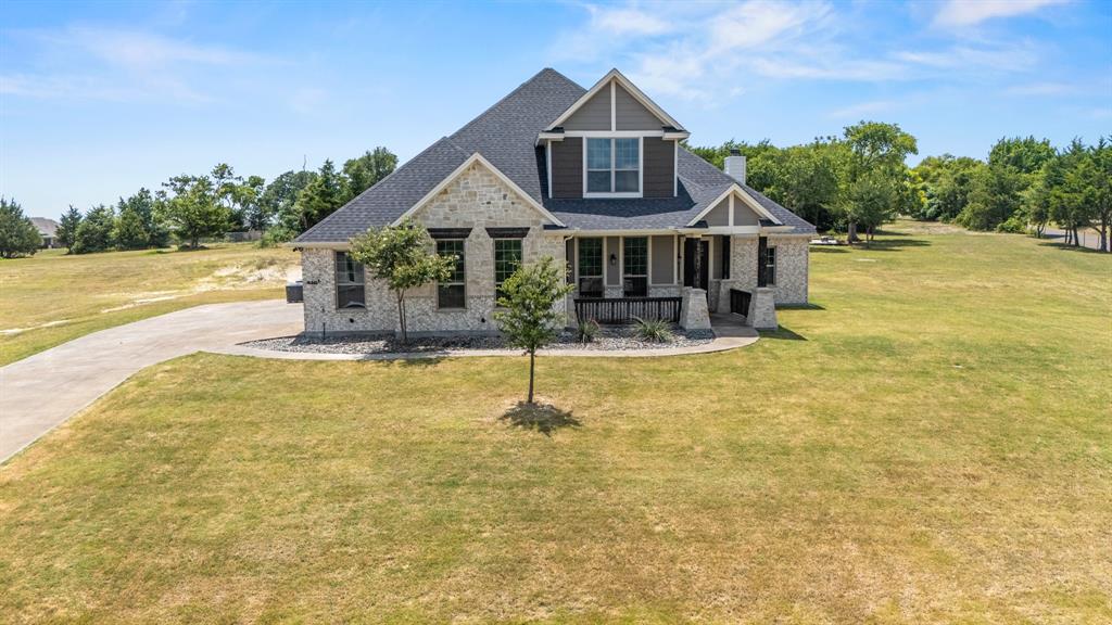 Welcome home to this stunning Texcraft built custom home tucked away on a private corner lot in a quiet cul de sac, sitting on 1.22 acres in the highly desirable Maypearl ISD. This 3,158 sq ft two story offers 4 spacious bedrooms, a media room, and an oversized 3 car garage, all wrapped in high ceilings and abundant natural light.

The kitchen is a true showstopper, featuring granite countertops, stainless steel appliances, a large island, a gorgeous breakfast bar, and hand stained wood cabinetry, all set beneath a custom tiled backsplash. Just off the entry, a custom tray ceiling and a beautifully finished half bath make a memorable first impression, while a custom accent wall adds character to the living room.

The oversized primary suite is a retreat of its own, complete with a tray ceiling, separate vanities, a garden tub, a separate shower, and a tiled accent wall above the tub for a spa like finish. Two separate AC units keep the home efficient and comfortable year round, with 2 full baths and a half bath rounding out this well laid out floor plan. The entire home has been freshly repainted and features professionally cleaned carpets throughout, making it truly move in ready.

Step outside to your own private oasis, covered front and back porches overlook the gorgeous acre plus lot, and the backyard patio is the perfect gathering spot for family hangouts and movie nights under the stars. Enjoy a custom 24x32 framed fire pit area perfect for entertaining, a stone pathway leading through the front, and a second stone & rock pathway winding through the backyard. Mature trees are thoughtfully finished with mulch beds and clean edging throughout, giving the grounds a polished, low maintenance feel.

Country living with room to breathe, minutes from everything you need.