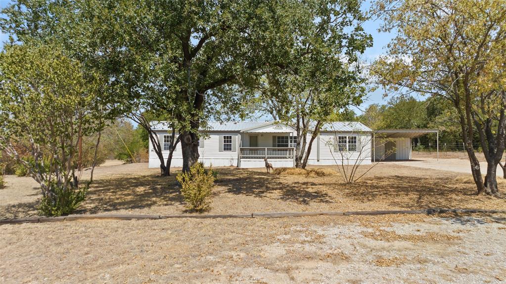 Updated 4 bedroom, 2 bath manufactured home on 2.5 beautiful treed acres.   Features: metal roof, new HVAC, new appliances, new fixtures, new paint, new floors, and more.    The adjacent property is also for sale, mls # 20428816, or both properties combined at 20428894.