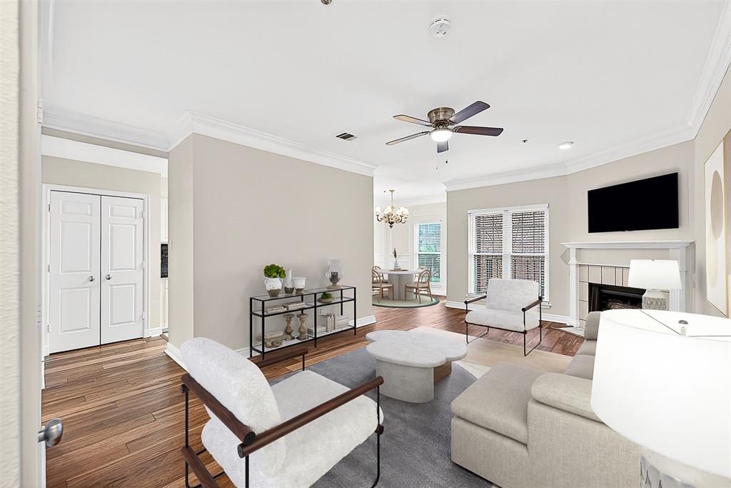 This beautifully appointed 2-bedroom, 1.5-bath condo is ideally located in the heart of East Dallas in a wonderfully architected red brick building shaded by mature live oak trees. Recently installed wood floors and fresh paint throughout create a bright, move-in-ready interior. The unit features a generously sized living area anchored by a cozy fireplace, flowing into a dedicated breakfast room and a well-designed galley kitchen with ample storage. A full-size utility closet adds everyday convenience. The front patio also offers tranquil views of the community pool. The primary bedroom features its own fireplace, a large walk-in closet, and direct access to the enclosed back patio providing a private outdoor space ideal for relaxing. Additional highlights include two covered, gated parking spaces. With its thoughtful updates, functional layout, and prime East Dallas location, this condo offers comfort, charm, and exceptional value.