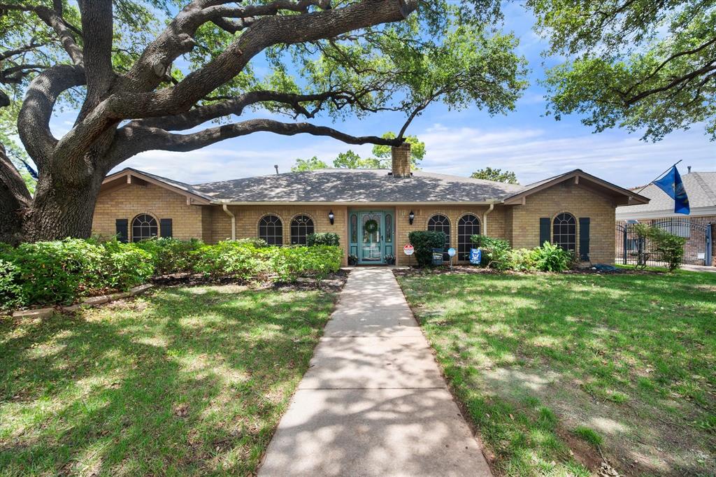 Spacious 4-bedroom, 3-bath single-story home with a sparkling in-ground pool in a highly desirable South Arlington neighborhood. Beautiful curb appeal with mature trees, lush landscaping, and a rear gated drive. Formal living and dining rooms flank the entry—formal living features a ceiling fan and is ideal for a home office, while the dining room offers easy kitchen access.  The updated kitchen boasts painted cabinetry, granite countertops, tile back-splash, smooth cooktop, double convection ovens, pantry and refrigerator included with an acceptable offer. The breakfast area is highlighted by a tray ceiling with beams and a unique curved wall of windows overlooking the covered patio and pool.  The spacious main living area features a vaulted ceiling with two skylights, gas fireplace with modern glass and stone accents, built-in shelving, tile flooring, and a large ceiling fan. The private primary suite is located at the rear of the home with patio access and an en-suite bath featuring a barn door entry, dual granite vanities, oversized jetted garden tub with pool views, separate shower, and two walk-in closets.  Secondary bedrooms are well-sized. Bedrooms two and three share a Jack-and-Jill bath with an updated oversized shower, while the fourth bedroom is split and includes a private full bath—ideal for guests or multi-generational living.  The converted garage offers abundant lighting, a wet bar, and rear driveway access—perfect for a workshop, craft room, or bonus living space. A separate utility room accommodates oversized appliances and includes built-in cabinetry and extra storage.  Outdoor living shines with a large covered patio featuring two ceiling fans, overlooking the fenced in-ground pool (pump replaced in 2025) and nicely landscaped yard. Additional highlights include a storage shed with electricity including 220 & RV plug ins, solar screens, plantation shutters, and a new HVAC system installed in May 2026. Move-in ready and waiting for a new owner!