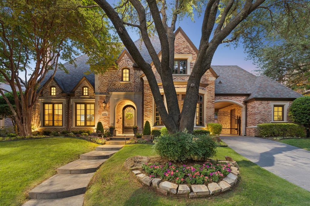 Welcome to 5880 Shady Oaks Drive, a refined luxury estate in one of Frisco’s most sought-after neighborhoods. Offering 5 bedrooms, 5.1 baths, and 5,545 square feet, this exceptional residence combines timeless architecture with extensive high-end updates completed within the last three years. From the moment you arrive, the home’s stately brick façade, mature trees, and elegant porte-cochère create a grand first impression. Inside, rich hardwoods, soaring ceilings, and curated designer details elevate every space. The main living area features a statement fireplace and abundant natural light—creating an inviting yet sophisticated atmosphere ideal for entertaining. The kitchen has been beautifully updated with refined finishes and premium appliances, highlighted by a Wolf commercial-grade range, custom cabinetry, and an expansive center island. A butler’s area adds convenience and style for hosting. The primary suite is a true retreat, featuring a fully renovated spa-inspired bath with luxurious materials, soaking tub, oversized walk-in shower, and designer finishes. The primary closet has also been completely reimagined, offering boutique-style organization and display. A first-floor guest bath has been thoughtfully updated to match the home’s elevated aesthetic. Additional recent improvements include re-stained first-floor hardwoods and replacement of multiple windows. Upstairs, expansive secondary living spaces include a game room and a dedicated media room, along with generously sized bedrooms—perfect for family and guests alike. Step outside to your private backyard oasis, where a resort-style pool and spa are surrounded by lush landscaping and covered patios, ideal for year-round relaxation or entertaining. This home offers a rare blend of luxury, comfort, and convenience—a truly exceptional opportunity to own a meticulously updated estate in one of Frisco’s most prestigious communities.