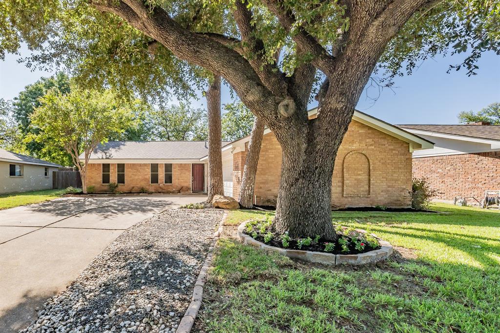 Designed for everyday comfort and easy living, this well-cared-for one-story home in HEB ISD offers 3 bedrooms, 2 full baths, and a functional, easy-flow layout. The brick exterior and side-facing double garage provide excellent curb appeal and added privacy. Beautiful landscaping and thoughtful design are highlighted by a large mature tree in the front yard, creating a welcoming first impression. Inside, the home features modern tile flooring throughout and ceiling fans in every room for added comfort. The kitchen offers a gas stove, granite countertops, and an abundance of cabinet space, opening seamlessly to a spacious family room anchored by a custom-paneled fireplace—creating a comfortable space for both everyday living and entertaining.

The primary suite offers a private retreat with a walk-in closet and an en-suite bathroom featuring a well-designed shower. Secondary bedrooms are well-sized and versatile for family, guests, or office space.

The backyard is generously sized with mature trees and established landscaping, complete with a nice covered patio and an additional large patio area ideal for outdoor enjoyment, gatherings, or relaxing evenings.

Major system improvements include a high-efficiency SEER 19+ HVAC system (2018), upgraded attic insulation, water heater (2020), fully replaced plumbing throughout the home, and a new roof installed in 2022, providing long-term value and peace of mind. Additional features include a covered porch, durable brick construction, and a well-maintained overall condition.

Conveniently located with easy access to major highways, shopping, dining, and everyday amenities. This home offers a great combination of comfort, functionality, and location. Schedule your private showing today.