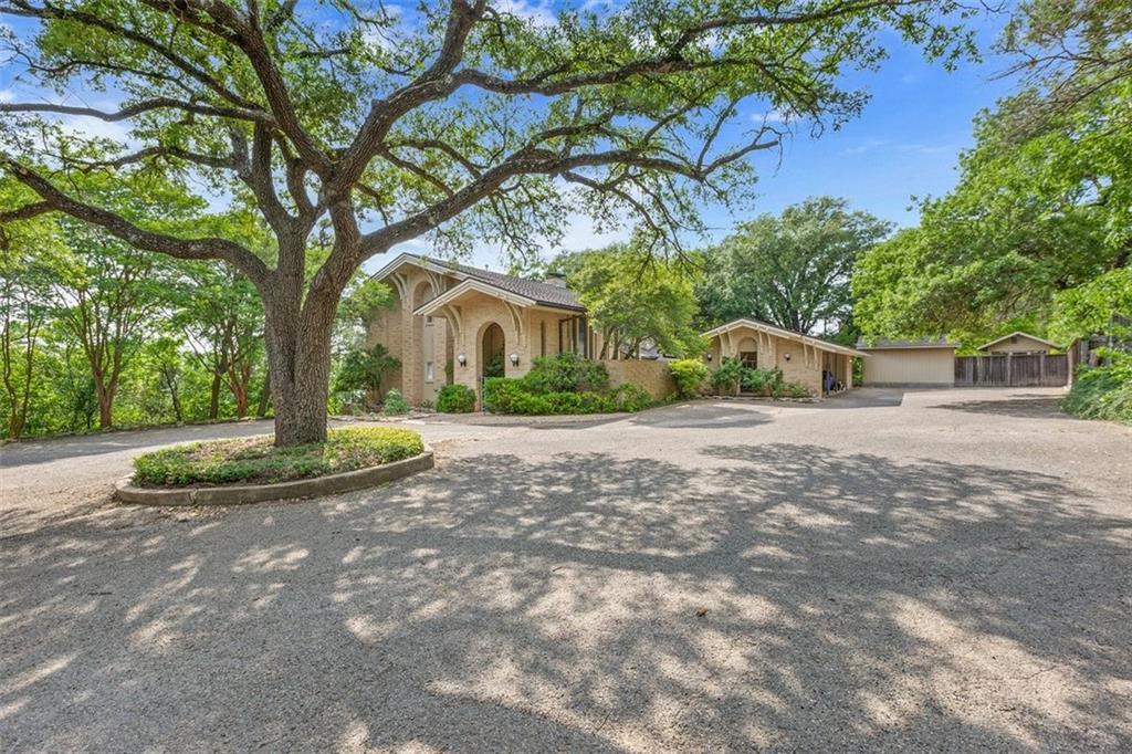 Extremely Rare opportunity to own this secluded masterpiece of a home designed by Waco Architect Shuford Farmer that sits on over 1.5 beautifully treed acres in Waco, Texas.  Dramatic entrance into the Courtyard welcomes you with one of a kind Royal Eniz stained glass creation that surrounds the front entry, stunning wood staircase,  beautifully inlaid floors, and views from the moment you enter the home. This Classy Home offers over 5,000 square feet, with 5 bedrooms and 5 full bathrooms, Library, Family Room with wall to ceiling windows overlooking the Tranquil backyard and Lake Waco, Wine closet, oversized Laundry room, Balconies off all upstairs Bedrooms, Wet bar, beautiful Pool & lounge area, Green House, Garden area, Storage shed, Workshop area, and surplus of storage throughout home. Generous sized bedrooms throughout. Master bedroom with 3 closets, bathroom fit for a King and Queen, plus a Balcony to enjoy every morning & evening. Gourmet Kitchen with 2 Gaggenau ovens, a grilling island with a 6 burner Russell gas cooktop, Abbaka custom range hood, Built in Fridge, additional Subzero Fridge/ Freezer, abundance of storage and counter space, and living or dining area overlooking the pool and backyard.

In 2022, this sensational home was the stage for a motion picture coming out in the near future by Malcom Goodwin. With exquisite taste throughout, stunning light quality in every space, serene surroundings - this One of a Kind Waco beauty offers privacy, comfort, and elegance.