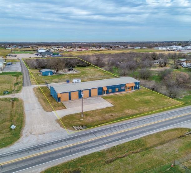 Newly Renovated
Outside Storage Opportunity 
7,206 SF
3.5 acres
4,312 SF Office
14’-16’ Clear Height
8 Grade Level Doors (12’x12’)
Secured Fenced Yard


The property consists of 3.5 acres with direct frontage along FM 917, positioned between I-35W, US-287, and US-67, providing convenient regional access across the greater DFW area. FM 917 serves as a primary east-west trucking connector and reliever route, allowing efficient circulation without relying on interstate travel, making the site well suited for contractors, fleet services, outside storage, and light industrial users. The roadway carries approximately 18,246 vehicles per day, offering strong visibility and accessibility in a functional industrial setting.