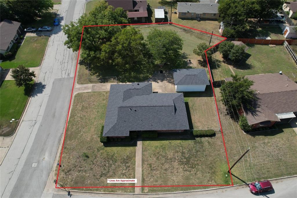 Corner Property with 2 lots and just over Half an Acre in an Established Neighborhood in Burleson! This Charming 3 Bedroom Home offers an Open Floor Plan with Large Split Bedrooms and a Bonus Room perfect for a Home Office, 2nd Living Room, or Garden Room. There's even a 10 X 7 Basement perfect for an Indoor Storm Shelter! Wood Countertops throughout. The kitchen has beautiful flooring, a Peninsula Counter Perfect for Entertaining, Plenty of Shelves and Cabinets, and a Double Door Pantry.  There's a mud room between the garage entry and the kitchen with a built in desk and bookshelf that works great as a small study. Also a Breakfast Coffee Bar.  The living room and dining room are open with a wooden beam along the ceiling. Outside is fenced with plenty of space for kids to play and have a garden too if you wanted! Concrete Driveway with Basketball area that connects the Separate Garage Workshop that includes Shelving, Electric, and a Large Storage Loft. This home has lots of space both inside and outside! The Property includes 2 lots, so there's the possibility of building a second home if buyer wanted OR just enjoy the Huge Yard! Come See this Beautiful Property Today!