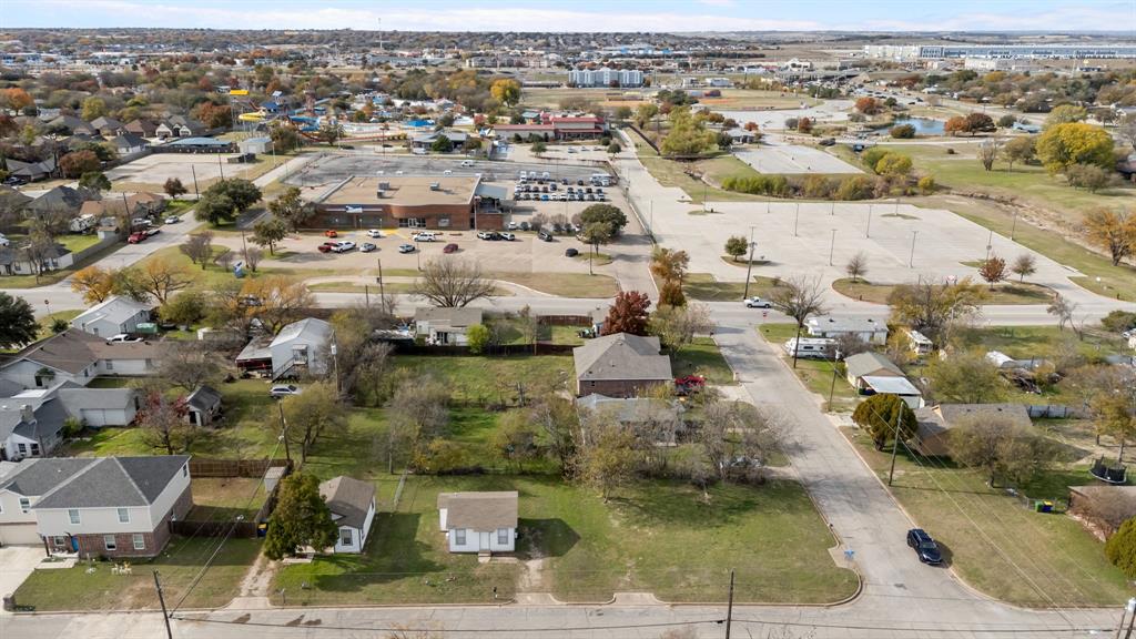 Rare opportunity to build on an affordable infill lot in the heart of White Settlement — with the option to acquire the entire corner. Located at 8707 Ronnie St, this corner lot (approx. 65×67) already has a driveway cut at the curb on each street and existing utility lines in place, offering major cost savings for a new build. A previous home once occupied the site, making this one of the most build-ready lots you’ll find in the area.

Adjoining properties are also for sale, including 309 Hallvale Dr (MLS 21185688) and 313 Hallvale Dr (MLS 21185130). All three properties sit together on the corner and can be purchased individually or as a package — creating a rare opportunity to control an entire corner footprint. Whether you’re an investor seeking rental income plus future development potential, or a buyer looking to build while holding neighboring property, the flexibility here is exceptional.

The location is outstanding — less than a mile from IH-820, providing fast access throughout Fort Worth and Tarrant County. Situated on the west side of Fort Worth, this area continues to experience strong growth and redevelopment, making it ideal for both an owner-occupant or an investor looking for long-term upside.

Veterans Park and Central Park are virtually across the street, creating an amenity-rich setting that’s hard to duplicate. Veterans Park is home to Splash Dayz, ballfields, pool, pond, walking trails, picnic areas, and the Pecan Cove Convention Center, while Central Park adds even more green space and recreational appeal — essentially a built-in lifestyle benefit right outside your front door.

Whether you’re looking to build your next home, secure a smart investment, or acquire a strategic three-property corner package in a growing area, this opportunity delivers location, flexibility, and long-term value that’s becoming increasingly difficult to find.