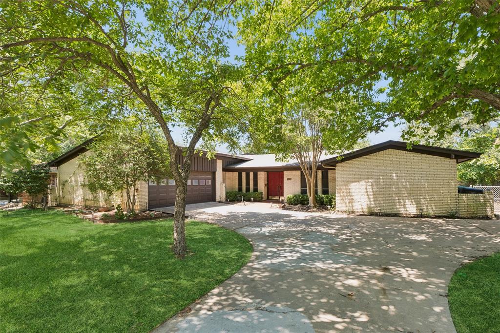 Welcome to this beautifully maintained mid-century home in the established Belvedere Estates neighborhood, where timeless architecture meets an exceptional golf course setting. Perfectly positioned along the 17th green of Meadowbrook Golf Course—recognized among the top municipal golf courses in Texas—this property offers sweeping views of lush fairways, tranquil water features, and a picturesque bridge. With no homes or commercial buildings behind the property, the backyard provides a rare sense of privacy and scenic beauty. Mature shade trees and thoughtfully designed landscaping featuring Texas native plants create inviting outdoor spaces year-round. Inside, spacious living areas include a warm and inviting den anchored by a dramatic floor-to-ceiling stone fireplace, plus a second living room filled with natural light and overlooking the golf course. The functional floor plan also features a separate utility room with extra cabinetry, abundant attic storage, a generously sized garage complete with a workshop bench and storage closet, dual HVAC systems, dual water heaters, an irrigation system, and an infrared radiant barrier in the attic to enhance year-round energy efficiency. Additional security features include a monitored security system and reinforced security door bars for added peace of mind. Refrigerator, Washer & Dryer included with the sale of the home!  Conveniently located in East Fort Worth with quick access to I-30, I-20, Loop 820, downtown Fort Worth, and the Mid-Cities, this well-built home combines classic character, quality construction, scenic surroundings, and an ideal location for today's lifestyle. Schedule your private showing today.