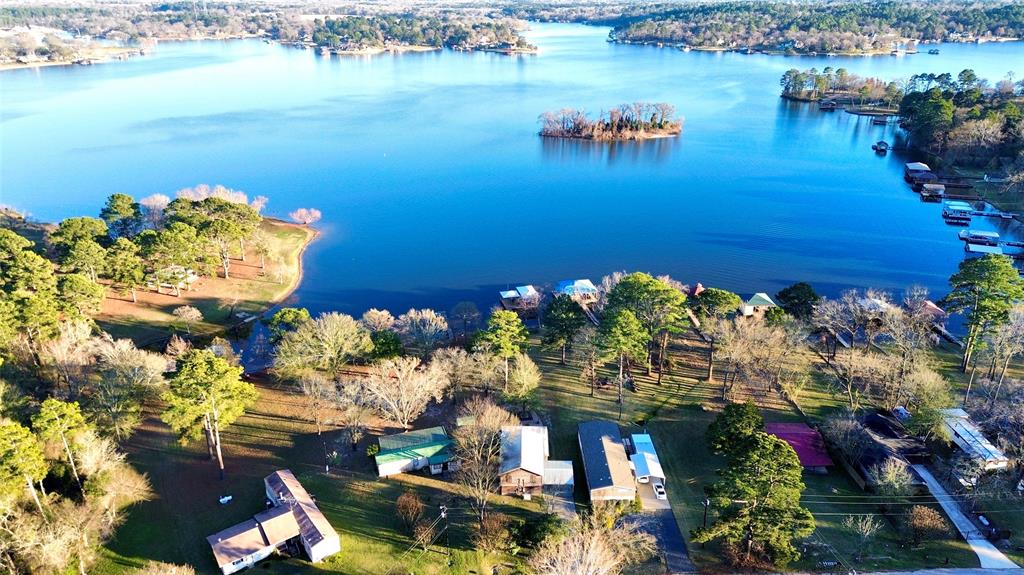 WATERFRONT LAKEHOUSE ON LAKE PALESTINE
Experience true lakefront living at 22557 Water View Circle in Flint, Texas, a stunning waterfront home situated directly on Lake Palestine with direct lake access and a like-new private boat dock. Sitting on over a half acre of land, this exceptional property offers the perfect blend of privacy, recreation, and convenience.
Located just 12 minutes from South Tyler, with easy access via Highway 150 and Highway 155, this lake house is ideal as a full-time residence, weekend retreat, or vacation getaway. Enjoy peaceful mornings on the water, unforgettable weekend barbecues, and effortless days spent boating, tubing, or fishing right from your own dock.
This four-bedroom, three-bathroom home is thoughtfully designed for comfort and entertaining. Spacious living areas invite natural light and lake views, while the open layout makes hosting family and friends effortless. Whether you’re relaxing indoors or gathering outdoors by the water, every space is designed to enhance the lake lifestyle.

You’ll love the convenience of being close to fine dining, shopping, and entertainment in South Tyler, while still enjoying the serenity of a private lakefront setting. From sunrise coffee on the dock to sunset cruises across the water, this home delivers the lifestyle buyers are searching for.