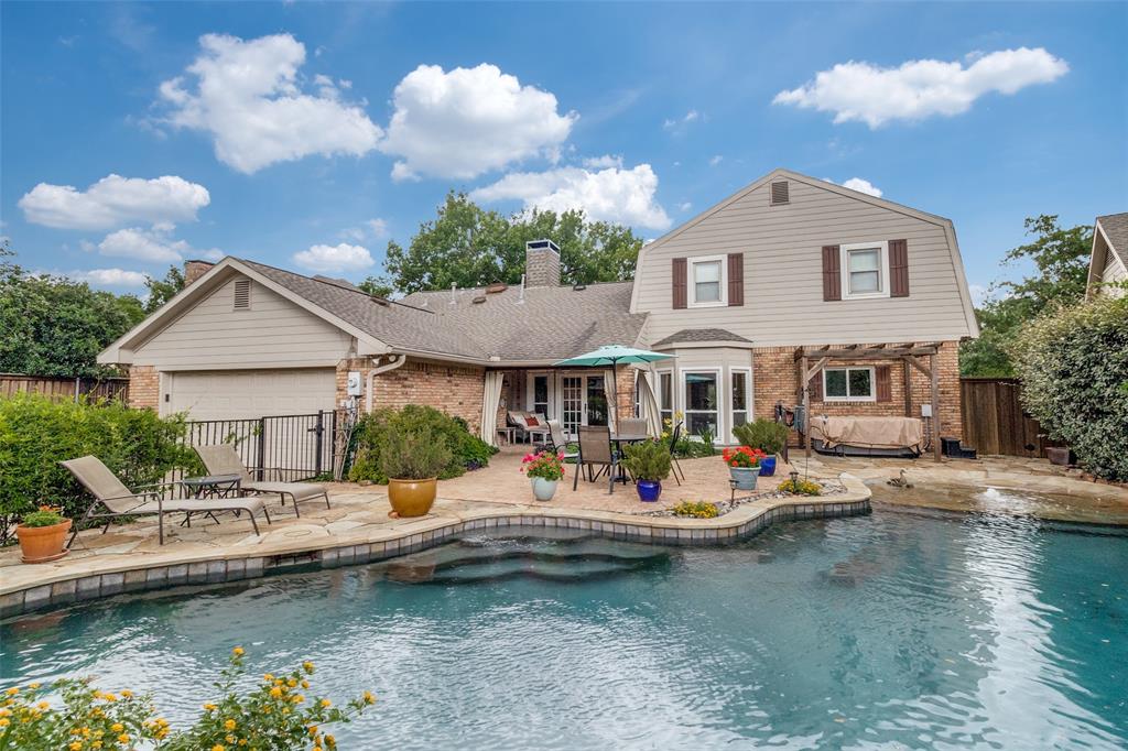 Wake up to pond views, send the kids to Plano ISD, and unwind in your own resort-style backyard. Set directly across from a serene pond and 13 acres of lush greenbelt, this beautifully updated 4 bedroom, 3.5 bath Country Brook home delivers the privacy, scenery, and walkability rarely found at this price. A main-level primary suite enjoys tranquil water views, while three spacious ensuite bedrooms and a flexible upstairs living area provide room for everyone. Step inside to a thoughtfully designed floor plan featuring a private primary suite on the main level, complete with peaceful pond views. Upstairs, you’ll find three generously sized bedrooms, each with ensuite access, along with an additional living area perfect for a game room, media space, or second lounge.  The stunning kitchen and breakfast area overlook the backyard and pool, creating an ideal setting for everyday living and entertaining.   Enjoy meals in the breakfast area, formal dining, or host guests in the elegant formal living room, complete with hardwood floors and serene pond views. Currently used as a home office, the formal dining room also works beautifully as a dining space, conveniently connected to both the kitchen and formal living room, and features lovely pond views. Outdoors, escape to a true resort style backyard oasis. Lush landscaping surrounds the pool and waterfall, offering privacy and a tranquil retreat. Additional highlights include a separate spa, extensive flagstone, a covered patio for entertaining or morning coffee, and a 12 foot board-on-board fence with a 12 foot electric driveway gate. Conveniently located with quick access to the Dallas North Tollway, President George Bush Turnpike, DFW Airport, and Love Field. Enjoy nearby shopping at Sprouts, Kroger, and Tom Thumb.  This home seamlessly combines luxury, location, and lifestyle. An exceptional opportunity for today’s discerning buyer.