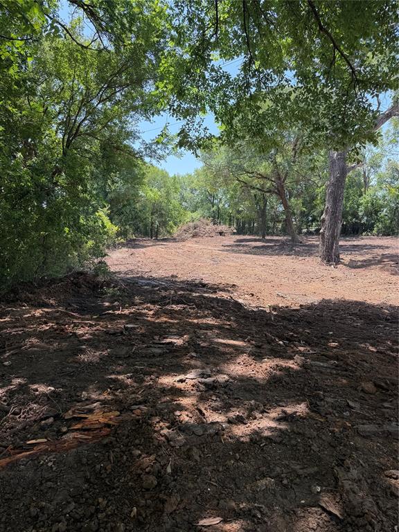 2.529 Acres part of 1853 Ranch recently sold.  Enchanting newly cleared parcel with mature hardwood trees and lots of privacy.  This property is outside city limits and no deed restrictions.  This prime property is 9.7 miles from Granbury Square, 15 miles from Weatherford, and 30 mile from Fort Worth.  The property has recently been cleared from dense saplings and overgrowth, and the soil has been seeded.  It is an ideal homesite, multi family property, or even perhaps a tiny home community.  There are many wells in the area 325-400 ft.  Electricity is available. The survey is attached in documents.