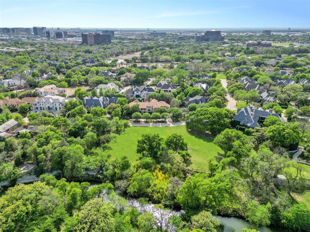 Located within the exclusive, gated and guarded community of Glen Abbey, this premier 1.099-acre estate lot presents a rare opportunity to build a truly exceptional residence. Nestled on a beautifully treed homesite and backing to the serene White Rock Creek, 48 Braewood is positioned on one of the community’s most coveted streets. Bring your vision to life in collaboration with renowned luxury builder Bob Thompson and his architectural team. Known for forward-thinking design and uncompromising craftsmanship, Bob creates homes that define the pinnacle of sophisticated living. From expansive views and a statement entry to a thoughtfully curated kitchen, and an extraordinary primary retreat, every detail can be tailored to reflect your personal legacy. Glen Abbey offers a premier North Dallas location, surrounded by Bent Tree Country Club and Preston Trails Golf Club. Just minutes from the city’s finest dining, shopping, and amenities. 48 Braewood is more than a homesite—it is one of Dallas’ true gold-standard addresses.