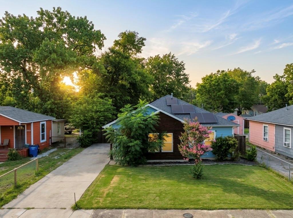 CONSIDERED A NEW BUILD HOME W.QUAILITY UPDATES INCLUDE PAID OFF SOLAR PANELS, Storage building & ALL APPLIANCES! NEW GRASS, NEWER HVAC- NEWER WINDOWS - NEWER LIGHT FIXTURES & CANNED LIGHTING- NEWER COUNTERTOPS & TILES- NEWER TILE FLOORING - NEWER DOORS & FINISHES! Long Driveway with room to extend parking, bring your work truck or trailer. Downtown Dallas nearby & quick access to Fort Worth & the entire metroplex, easy highway & public transpiration access. Handicap accessible throughout, Open Spacious Layout! Kitchen offers alot of countertop space and storage ,space to add kitchen island if desired. Tall ceilings, wide doorways, Covered back patio overlooking wide backyard with mature trees. Backyard is completely fenced with privacy fence & fences in front. Easy living, Ideal starter home & investment property!