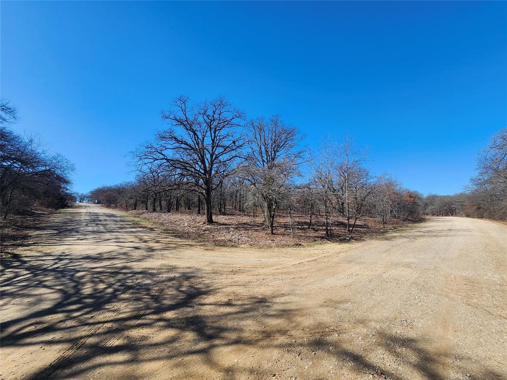 2 Corner lots with Mature Oak trees. Great building site .66 of an acre. Lots are surrounded by the tranquility of nature as you will often see deer all around the property. Nocona Hills offers a 24-hour guarded gated community with access to two private lakes (one listed as top 5 Bass fishing in Texas)a community boat ramp and dock, as well as an 18-hole golf course with driving range, an airstrip, campgrounds with RV sites, and more. Utilities include co-op water and electric already at street. Fiber optic high speed internet is also available. Nearby surroundings include historic downtown Nocona, a winery, brewery and just a short drive to Saint Jo, Muenster and popular Casinos. Come see this gem. Owner has multiple lots available to choose from, please contact listing agent for details.  The Club house is under remodel along with the pool such an exciting new Update for the community.