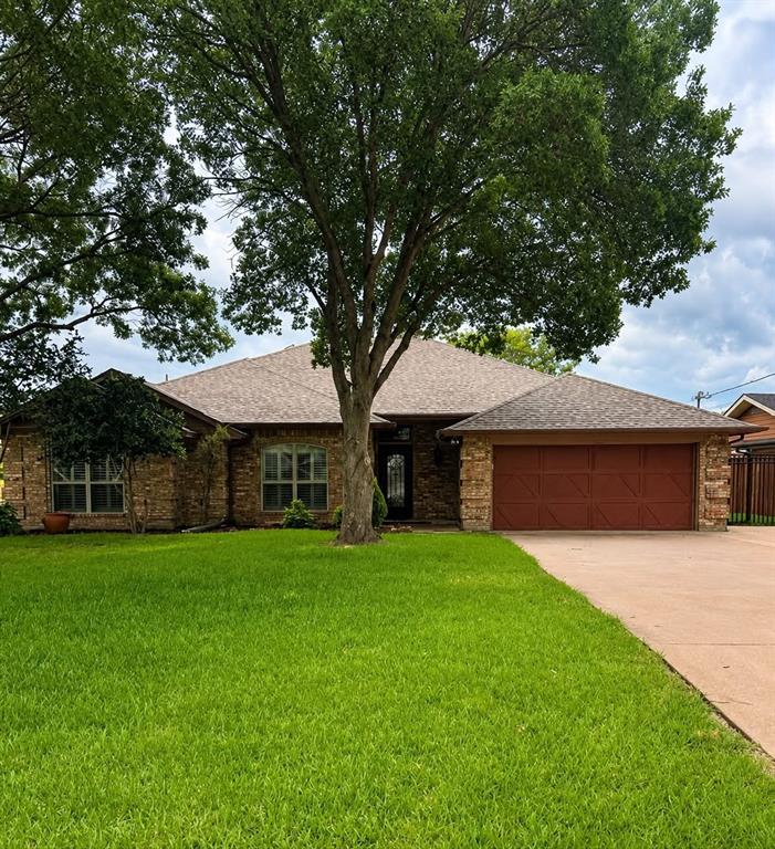 Beautifully updated lakefront home in The Shores addition of Granbury, no City Taxes, outside City limits, no HOA! Can be an Airbnb! This move in ready property features wood look ceramic tile flooring, fresh interior and exterior paint, and plantation shutters throughout. The open layout offers vaulted ceilings and abundant windows, filling the home with natural light and showcasing peaceful lake views. The spacious kitchen is perfect for entertaining with new quartz countertops, stainless steel appliances, and a large island. A reverse osmosis water drinking system adds extra convenience. The primary suite includes a newly updated bath with quartz countertops, an oversized shower, and a lighted vanity mirror. Step outside to a 21x18 covered porch under a cedar pergola that is ideal for relaxing or entertaining lakeside. The impressive 18x35 dock features a 10.5x25 boat slip, 30-ft touchless remote-controlled boat cover, 4,000 lb boat lift with V hull cradle, and a 4.75 kW solar system. Additional upgrades include a new HVAC system, a roof just 6 years old, and a sprinkler system powered by a 220V 1.5 HP pump with low-cost lake water usage approx. $53 per year. Enjoy lake living at its best with modern updates, energy-efficient features, and exceptional outdoor amenities!