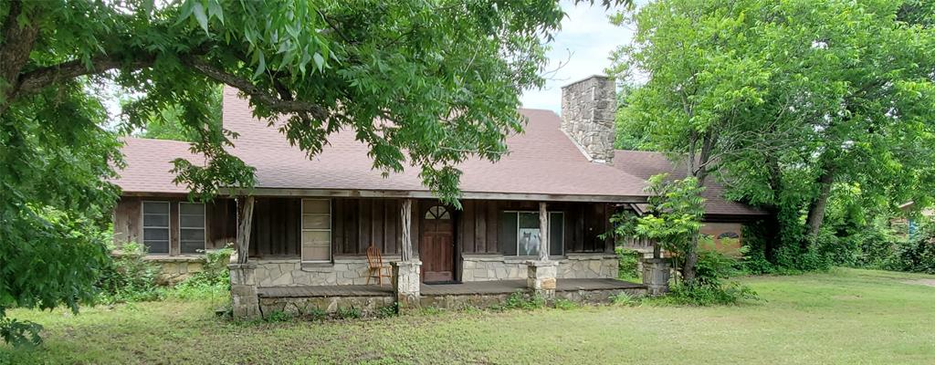 Nestled on 10 serene acres in Mansfield ISD, this rare offering features two charming homes, providing ample space for family, guests, or rental potential. The main home has 3 bedrooms with 2 bathrooms. Upstairs is a large game room. The second home was built in 1985 and has 1590 sq ft. It has 2 bed & 2 bath. Both homes do need some TLC. The property also boasts a 7-stall horse barn with a tack room—ideal for equestrian enthusiasts. Multiple other buildings on property including a large concrete open equipment shop.  Surrounded by majestic Pecan trees, oak trees and a seasonal creek, you’ll enjoy complete privacy despite being just off a busy street. Not inside city limits, it’s a peaceful retreat ready for your dreams.