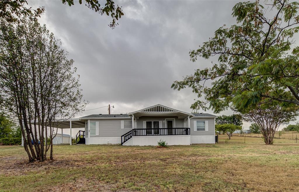 Nicely updated 3-2 on 1 acre. New paint and carpet. It has a 2 car carport with a tornado shelter!  Only 45 minutes from the metroplex. Come see this beautiful home and make it yours!