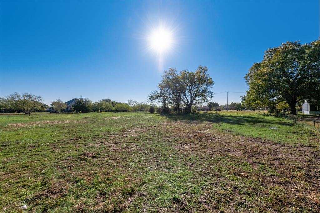 Large 1.97 (201' wide by 396' deep, from Denton cad map) acre lot.  Build your dream home with plenty of open space.  Conveniently located to shopping, schools and Lake Lewisville.  Hard to find open land in Oak Point! Nice mix of trees on property.  Private water company available.  Septic required.  Electricity available at street.