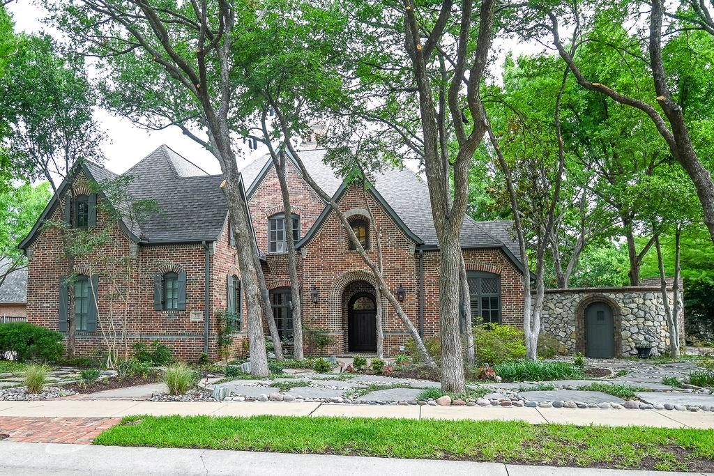 Dramatic Holmes custom on the market for the first time! This home was built for entertaining! The entry greets you with soaring ceilings, a dramatic staircase, hand-scraped hardwood floors and an open floorplan. The living room features a wood-beamed ceiling, double-sided fireplace, large picture windows, and easy access to the kitchen and dining areas. The kitchen has floor to ceiling custom cabinetry, under counter lighting,  breakfast bar, butlers pantry and walk-in pantry. New Bosch appliances in stainless steel include a double oven, microwave, dishwasher, and side-by-side built-in refrigerator. The primary bedroom is large with room for a sitting area. The bedroom enjoys wonderful views of the backyard and patio access. The primary bathroom has been meticulously updated and boasts porcelain tile floors, a freestanding jetted tub with LED lighting, a large spa-like shower, and tons of vanity space. Double walk-in closets provide tons of storage and offer custom built-ins. A private office with closet and garage access work from home easy and an additional den with courtyard access could double as a second office or sitting room. The split second bedroom downstairs provides an opportunity for generational living. Upstairs you will find a large game room and custom home theater with video equipment and seating along with two additional bedrooms. One bedroom has an ensuite bath with tub and shower and a large walk-in closet. The second bedroom upstairs is huge and has a large walk-in and access to the second staircase. The home is on an amazing lot with lush landscaping and mature trees, and the backyard is a private oasis featuring a stunning Claffey custom pool with multiple waterfalls and an elevated spa. Private courtyards and sitting areas complete the outdoor living space. The three car garage is split and oversized. The home is served by the award-winning Coppell ISD and is close to major transportation and world-class dining and shopping!