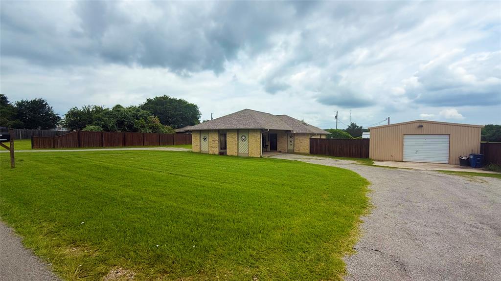 If you have been dreaming of trading city noise and cookie-cutter neighborhoods for starlit skies, wide open space, and a backyard that actually takes your breath away, this is the one. This 3-bedroom, 2.5-bath home featuring two primary suites sits on a quiet stretch near Eagle Mountain Lake where your only rear neighbors are cows grazing in the pasture, and that is exactly the point. Pull up the circular driveway, park under the porte-cochere, and step into a life that moves at your pace. The roof is in great condition, the foundation is solid, and the HVAC runs great, giving you the confidence to come in and focus your energy on making it uniquely yours. The inground pool with waterfall, huge detached shop, and covered back porch complete with ceiling fan, lights, and a bar were made for late summer nights, cold drinks, and the kind of memories that stick. Quick access to Highway 199 keeps you connected without giving up the escape. Priced to sell and offered as-is, this is your opportunity to stop dreaming and start living.
