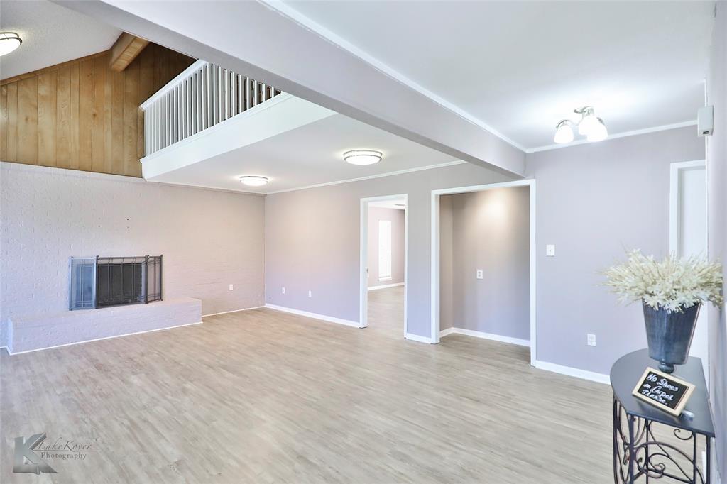 This exceptional property is located on a peaceful cul-de-sac. Walk in and see the living room is enhanced by vaulted ceilings, tons of natural light and a beautiful feature brick wall with a fireplace.  Downstairs the master bedroom is a true retreat, featuring two spacious closets complete with shelving and ample storage and private access to the back patio. There is also a large heated-cooled flex space that can be transformed into a bonus room, media center, or game room.  A lovely reading nook with a built-in bookcase awaits on the open landing upstairs, creating a cozy corner to indulge in your favorite books. Upstairs you'll find three large bedrooms, each offering comfort and privacy. The great Jack and Jill bathroom features double sinks and a long counter area, while an additional sink with a mirror is available in another bathroom, ensuring convenience for daily routines. Recent updates include newly painted kitchen walls and cabinets, new flooring, new carpet and more.