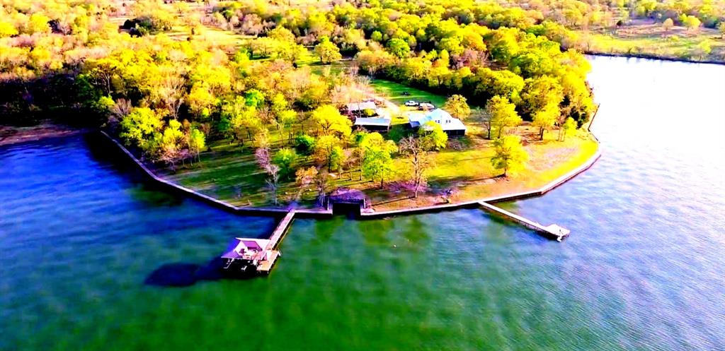 One of the most unique private waterfront estates on Richland-Chambers Lake—72 acres with approximately 2,000 feet of open shoreline.

Wake up to panoramic open-water views and experience the rare combination of acreage, privacy, and protected shoreline.

This exceptional property features a 2024-built main residence, separate cabin, and multiple structures, creating an ideal setup for a private retreat, family compound, or multi-use property.

Approximately 6 acres are within the HOA, while the remaining acreage is completely unrestricted - an increasingly rare combination on the lake.

Property features include two private docks, steel retaining wall, gated entry, ag exemption, and expansive open-water views. The scale of both land and shoreline provides a level of privacy and control that is rarely available.

Enjoy a wide range of recreational opportunities including fishing, boating, hunting, and exploring your own private acreage - offering a true escape with room to create your vision.

Whether for personal use, investment, or long-term legacy ownership, this property offers flexibility and scale that is rarely available on Richland-Chambers Lake.
VIDEO link in transaction documents.