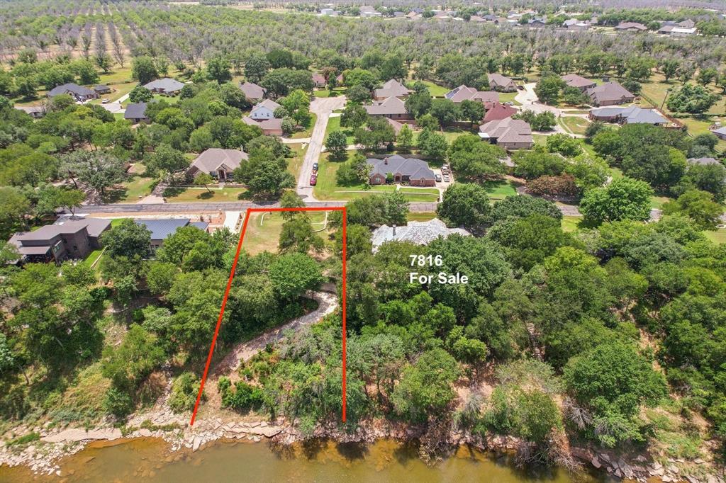 Stunning New Construction on the Brazos River in Pecan Plantation. Welcome to a rare opportunity to own a brand-new, impeccably designed home nestled along the scenic banks of the Brazos River in the sought-after Pecan Plantation community. This thoughtfully crafted residence blends modern elegance with tranquility of waterfront living, offering a lifestyle defined by luxury, comfort and natural beauty.  From the moment you arrive, the home's striking curb appeal sets the tone. Clean architectural lines, premium finishes, and expansive windows that invite natural to pour in while framing breathtaking river views. inside unfolds with soaring ceilings plank engineered floors, and designer fixtures throughout. The gourmet kitchen is a chef's dream, featuring custom cabinetry, granite countertops, a large center island. perfect for entertaining on a grand scale. This presence runs through the rest of the house. Beyond your doorstep, Pecan Plantation delivers an unmatched country club lifestyle. Don't miss this opportunity and call for your appointment today. Finish date around the end of this year. Builder SWP Custom Homes