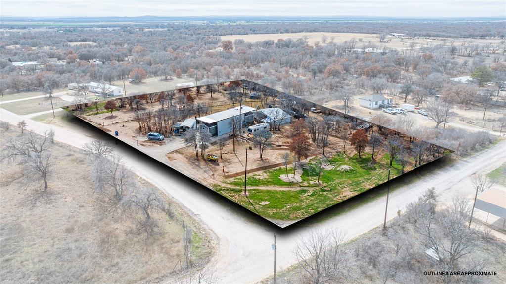 MASSIVE PRICE DROP-SELLER RELOCATING! Enjoy the best of rural living with strong regional growth nearby, including close proximity to nearby Haskell County's new GOOGLE AI Data Center development currently underway, bringing significant expansion to the region.  This comfortable homestead on two (2) acres also offers convenient access to Abilene's shopping, dining, medical facilities, and recreation, making it a perfect balance of country space with city convenience!  With a spacious two (2) acres outside city limits, the property has the possibility of not one, but two on-site sewer facilities allowing for expansion to additional mobile recreation vehicles or more permanent site built-additional manufactured home.  A peaceful setting that includes, but not limited to a small pond, water well, carport, and storage shed.  What a great retreat or rental investment!  Possibilities are endless with the nearly new 2025 Palm Harbor 14 x 66 single-wide manufactured home with three (3) bedrooms and two (2) baths, not to mention protected from the elements, beneath a large metal awning plus metal under-skirting for easy maintenance.