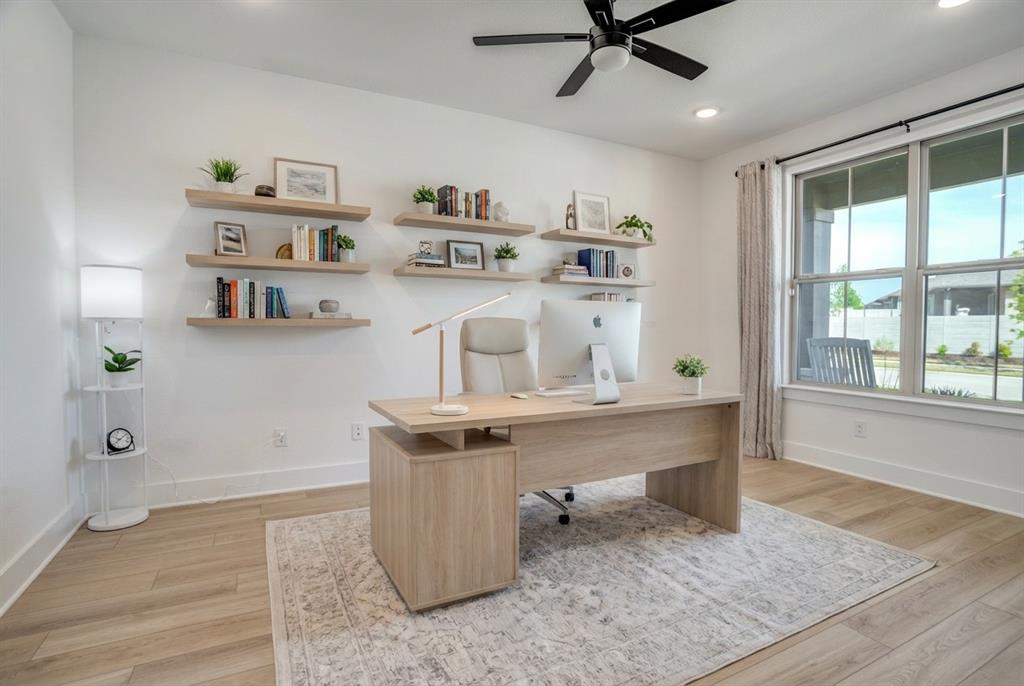 Some homes are built. This one was curated — and it shows the moment you walk through the door.

Nestled on a lush greenbelt lot in sought-after Painted Tree, this east-facing home feels better than new, with thoughtful upgrades around every corner. A private office with glass French doors sets the tone. The living room glows with flush-mount LED lighting, flowing seamlessly into a stunning open-concept kitchen featuring marble-look quartz countertops, upgraded cabinetry, champagne bronze fixtures, a large granite composite single-bowl sink, a 5-burner gas cooktop under a Cambridge Wood Hood, and a charming box window in the dining nook. Downstairs also includes a half bath, laundry room, and built-in cubbies right off the garage — because everyday life should be effortless.

The primary suite is your escape — bay window, spa-like bath with a large walk-in shower, double sinks, and a walk-in closet that won't disappoint.

Head upstairs to a massive game room, an oversized media room pre-wired for 5.1 surround sound and flat-screen viewing, and three generous bedrooms, each with a walk-in closet — one complete with its own ensuite. The second full bath features double sinks and a private water closet.

Out back, a covered patio with a gas stub overlooks serene green space through a wrought iron fence — your blank canvas for outdoor living. The 2-car garage is EV-ready, and front uplights plus holiday-light outlets in the eaves make this home shine year-round.

8-foot interior doors. East-facing light. Greenbelt privacy.

Come see it — you won't want to leave.
Ask about the exclusive lender incentive offered, a 1-0 buydown paid by lender