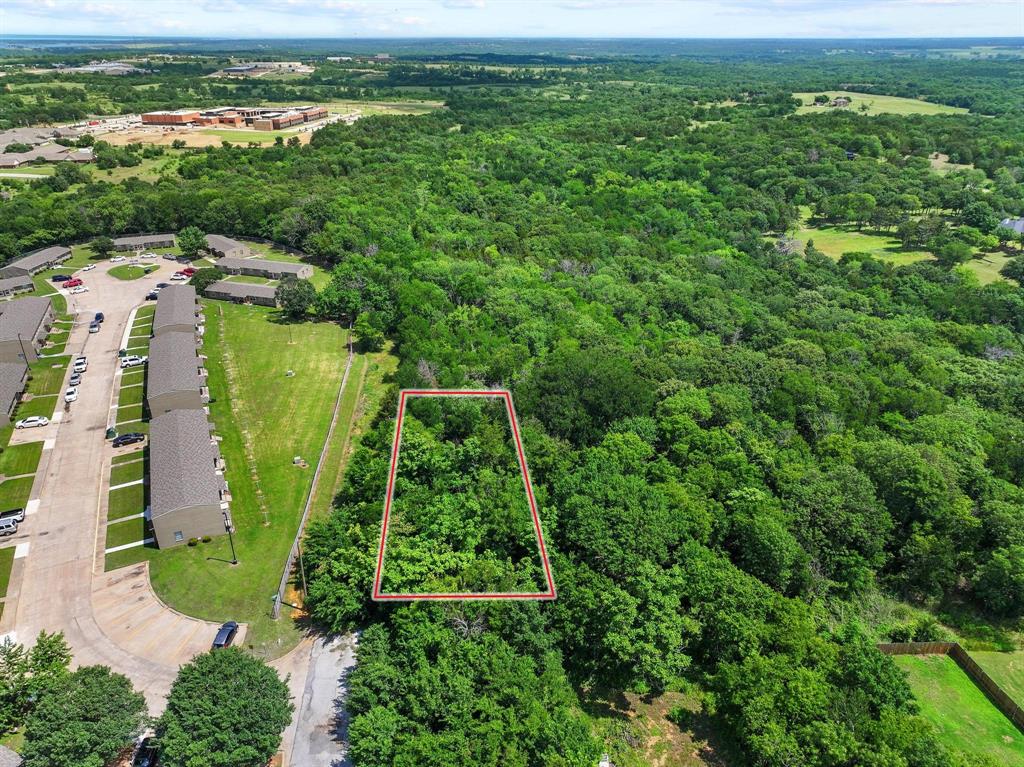 Residential lot in North Denison with convenient access to Denison High School. Great potential for future homesite or investment property. No current paved access to the property. Buyer and buyer’s agent to verify availability of utilities, zoning, access, and all development requirements. Information deemed reliable but not guaranteed.