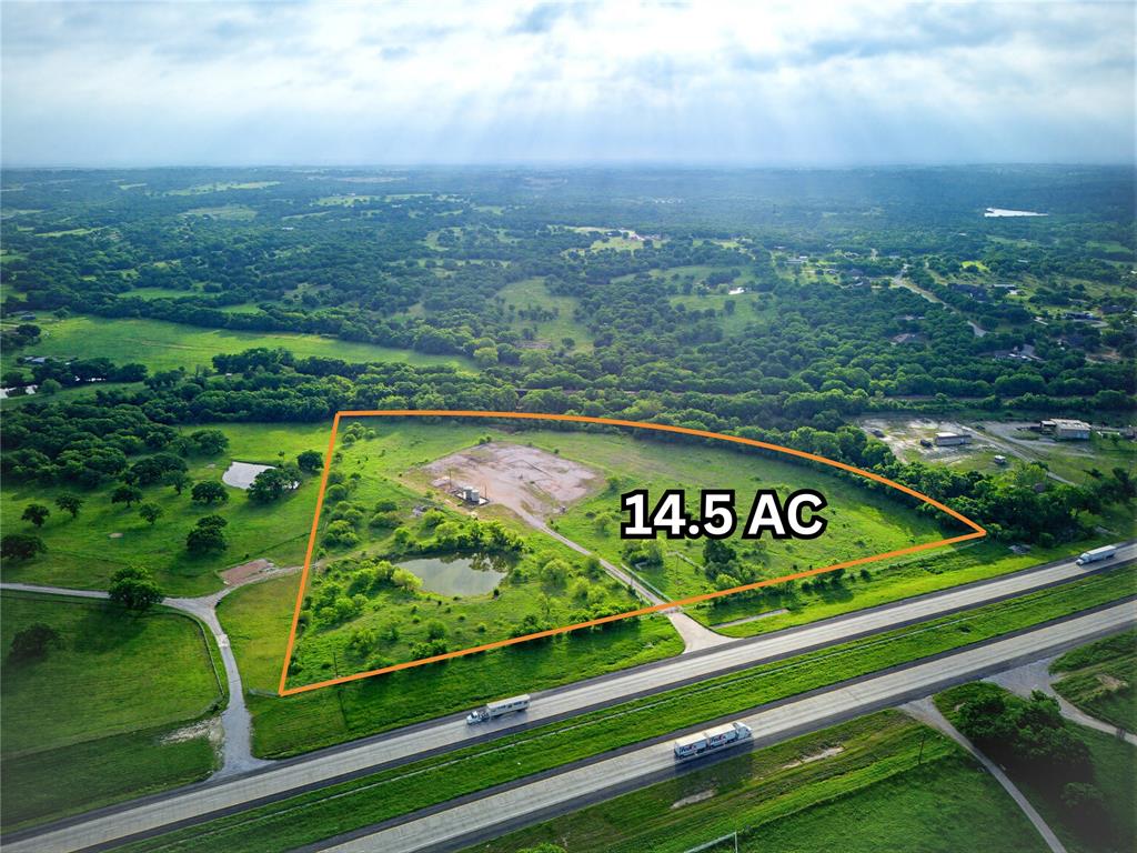 Looking for an investment property with almost 1,000 ft of Hwy 287 road frontage located less than 5 miles from Decatur? This property could be exactly what you need for your growing business or the availability to create your own business park outside the city limits located on a heavily travelled corridor. Don't let on and off access from a hard-to-get approved driveway be of deterrence. The engineering has already been done and approved by TX DOT and the county for allowing large flex space buildings. Whether you are wanting to purchase and hold or get the ball rolling with installation of high revenue leasing opportunities, this 14-acre tract has plenty of space to maximize your returns. Currently ag exempt and vacant land, the due diligence has already been done allowing you to purchase with confidence. Use it as it has been designed by the engineers or tailor it to fit your needs.