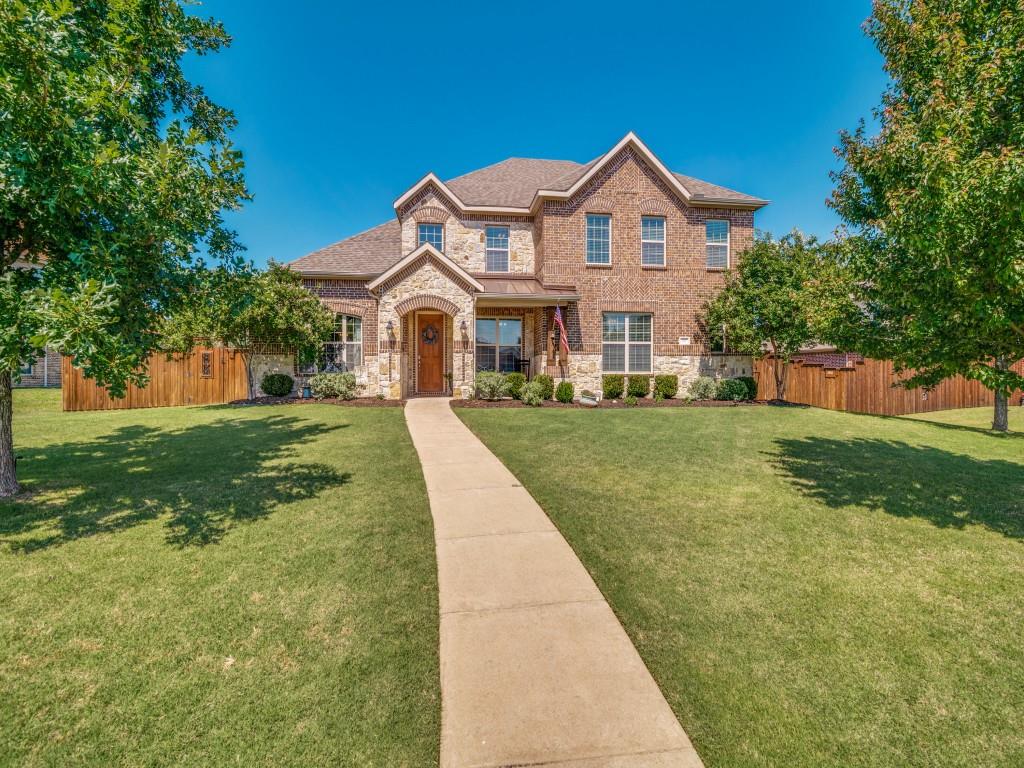 Discover this 5-bedroom, 4.1-bath residence with a stunning back yard!  The main level boasts two generous bedrooms, the primary suite and an additional bedroom, each with ensuite baths, providing convenient and flexible living arrangements.  Experience the joy of cooking in this fully-equipped kitchen with granite countertops, a sleek gas cooktop, recessed lighting, and abundant cabinetry for all your storage needs. This culinary hub seamlessly flows into an inviting family room, perfect for entertaining or simply relaxing in style.  Venture outside to find a backyard oasis designed for a lifestyle of leisure. Enveloped by a board-on-board wood privacy fence, the meticulously landscaped grounds boast a sizable pool, an outdoor fireplace, grill, and sink — ideal for weekend barbecues and evening gatherings. Enhance your gardening projects with existing container gardens and a shed for additional storage.  A solar gate was also installed across the driveway.  Architectural elegance is highlighted by the home’s striking brick and stone exterior, laying on a substantial lot that boasts both curb appeal and functionality. This residence offers the perfect blend of  amenities and comfortable space in a sought-after Sunnyvale location.  Highly rated Sunnyvale ISD schools and shopping and dining options nearby.