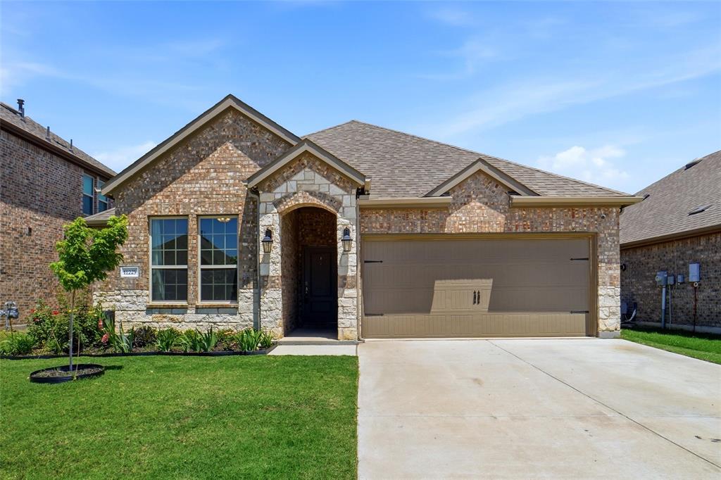 Located in the highly sought-after master planned community of Silverado.  This beautiful designed 3 bedroom home offers exceptional curb appeal with stunning stone entry facade with an inviting elevation.  The thoughtfully designed split-bedroom floor plan provides added privacy, with the spacious primary suite tucked away in the back of the home.  The open-concept kitchen is both functional and stylish, overlooking the main living area and featuring tall custom-style cabinetry, granite countertops, professional grade vent-a-hood with a beautiful wood-look ceramic tile flooring throughout the areas.  Step outside to a gorgeously landscaped backyard complete with stone pathway, raised planter boxes, perfect for growing flowers, herbs or your own vegetable garden. This home blends comfort, style, and functionality in one of the area's most desirable communities.  Don't forget to check the awesome HOA amenities including life guards at the main swimming pool.  There are a total of 3 separate HOA swimming pools and several playgrounds scatter across the neighborhood.  Walking path, bicycle trail, basketball courts, outdoor tables and more.