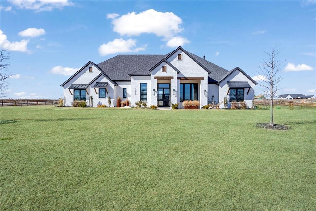 Luxury country estate featuring 5 bedrooms and 3 full baths on 1.80 acres. This custom-built home boasts high-end finishes throughout. The open-concept design flows seamlessly. Upon entering the home, you will be awed by the impressive great room, which showcases a striking black accent wall with an electric fireplace and soaring ceilings with a stunning chandelier.

The home also offers a 17x14 game room and a 17x12 media room. The dining area is an open space that connects the great room to the kitchen. 

The living areas and kitchen have wide-plank wood flooring. The chef’s kitchen is a dream for cooking enthusiasts, THOR double oven with gas cooktop, a large island, two sinks, tons of counter space, and an amazing walk-in pantry, which includes cabinets, ample counter space, and open shelving. The storage in this house is exceptional!

The primary bedroom offers wood flooring and a luxurious ensuite bath with dual vanities, a porcelain soaking tub, and a large walk-in shower. This spacious primary bath includes dual closets and a gun-safe room that can also serve as a tornado safe room. One of the four secondary bedrooms is situated apart from the others and has been utilized as an office. The laundry room features numerous cabinets, matching granite counters like those in the kitchen, a sink, and space for an extra refrigerator. 

Step outside to the spacious back porch(complete with automated screens) where you can enjoy breathtaking sunsets. The backyard is equipped with turf and a dog run. This property is located outside of city limits, boasting a favorable property tax rate of $1.67.

Pearlace Estates is a small neighborhood that offers luxury country estate homes. Conveniently located within 5 minutes of US 75. VAISD is an A rated school.- the highest in Grayson County.  Van Alstyne is a thriving small town with friendly folk.  Enjoy the many festivals, the weekly Farmer's Market and live music at the Downtown Social District. Come see!
