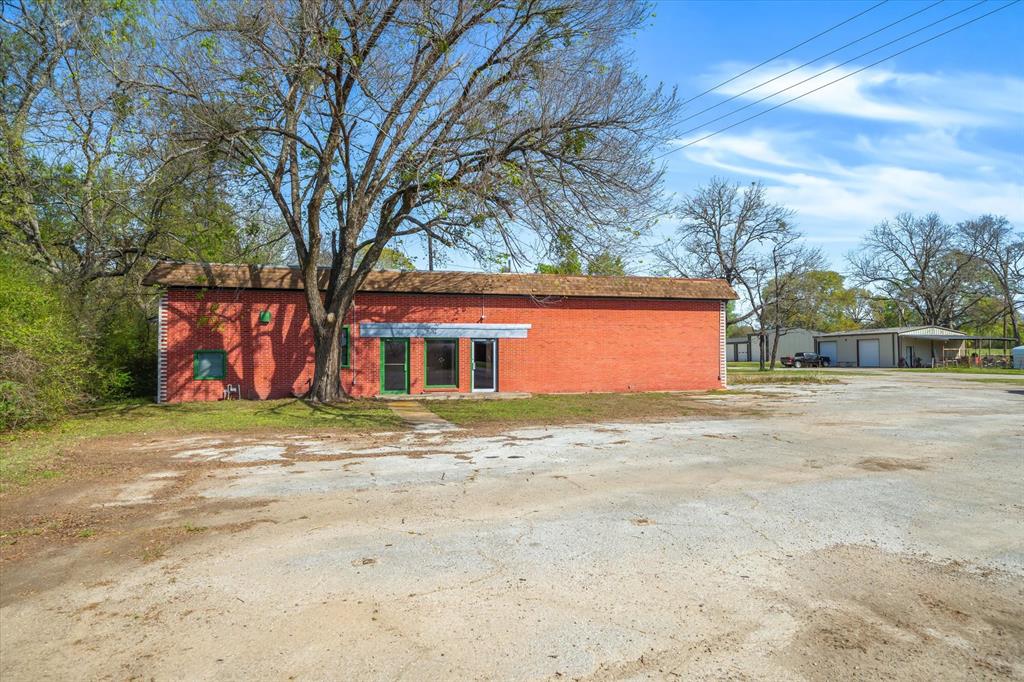 OWNER FINANCING AVAILABLE - CALL AGENT FOR DETAILS. Prime commercial property located in Grand Saline, offering excellent frontage on both Highway 80 and FM 17. This versatile property features two commercial buildings, making it ideal for investment or personal use. The asphalt parking lot provides ample space for vehicles, and the convenient circle drive allows for easy turnarounds, even for large trucks. Whether you choose to keep the existing buildings for your business, utilize the space for your personal needs, or start fresh with new construction, the possibilities are endless. Don’t miss this opportunity to secure a prime location with high visibility and easy access.