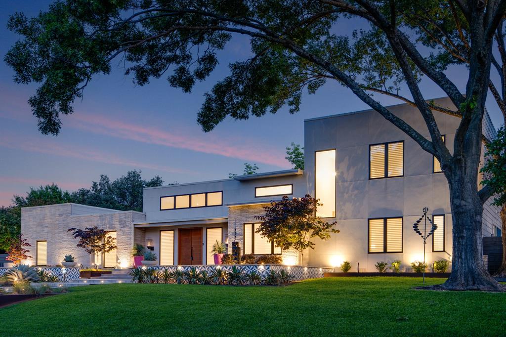 SO MUCH BETTER THAN BRAND NEW CONSTRUCTION   Just staged and refreshed. AND major price improvement.
This breathtaking modern masterpiece in the heart of the private school corridor unites sophisticated design and luxurious outdoor living.  The home’s commanding hilltop front entrance, flanked by imported Spanish tile, a custom granite fountain, and Turbotorch gas lanterns opens into a dramatic 2-story great room with soaring 15-ft ceilings, sprawling fireplace, oak floors, and clerestory windows.  The light-filled chef’s kitchen with custom cabinetry, quartz countertops, and built-in Stainless Steel appliances features a generous island with bar seating, large pantry with wine refrigerator, and separate butler’s pantry with beverage refrigerator.  The award-winning resort-like back yard, featured in Outdoor Living and Pool and Spa News, boasts an oversized covered patio with porcelain tile, built-in bar, electric shades, gas fireplace and a custom pool and spa with programmable LED lighting, electric sunshade, 2 decks, water features, and a 6-foot stainless sculpture. There are 4 bedrooms and a luxurios first floor study (which could be a 5th bedroom if desired), each with ensuite baths and extra-large walk-in closets, including primary suite with grand closet, dual vanities, soaking tub, and French doors out to the poolside oasis.  Spacious media room, extra-large laundry room, and 3-car garage with epoxy floor, overhead storage, and custom cabinetry complete this exquisite floor plan.  Other luxury upgrades include custom window coverings, a whole-house electric generator, whole-house water filtration and surge protection, UV air purification system, 180° directional recessed lighting, designer chandeliers throughout and much more... 
This amazing property is located on a premier street in The Hockaday Neighborhood. Easy access to the best private schools in North Dallas AND additionally zoned to the desirable Withers Elementary School in DISD.