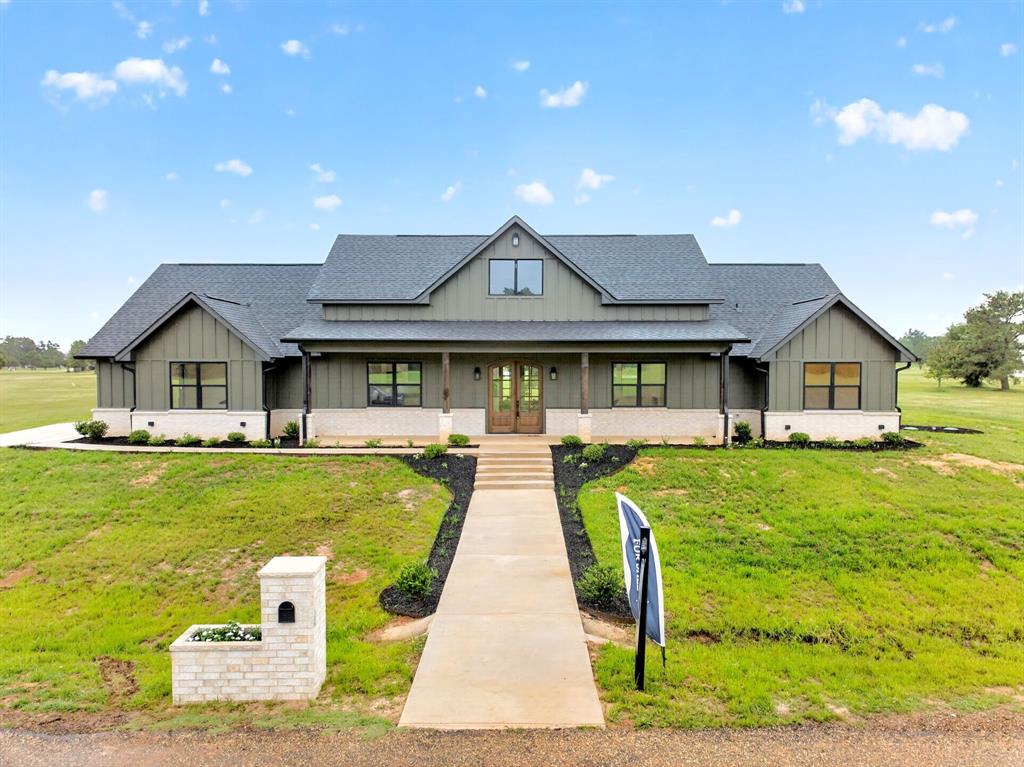 Experience the best of both worlds with this stunning 0.880-acres featuring pond frontage and beautiful views in The Peninsulas at Lake Bob Sandlin. Enjoy direct waterfront access on the pond, perfect for building your own private fishing pier. This thoughtfully designed home offers 3 bds, 3 full baths, and a dedicated office or bonus room. Designed for entertaining, the home showcases custom features. The gourmet kitchen features soft-closing cabinets, an 8-burner gas cooktop, double ovens, a pot filler, and floor-to-ceiling cabinetry, offering both style and functionality. The walk-through pantry provides exceptional storage, a built-in microwave, additional countertop space, room for a second refrigerator, a wine fridge, and a convenient grocery-loading access door directly from the garage for effortless everyday living. The garage is already equipped with an electric vehicle connection and direct access to a timer system for holiday lighting installation. The open-concept living area flows beautifully for gathering  and features a gas fireplace and custom built-ins. The primary suite is separated from the additional bedrooms, creating a peaceful retreat complete with a water view and spacious bathroom featuring a self-cleaning heated Bidet toilet. A large laundry room is located just off the primary suite, while the walk-in closet includes built-ins and direct access to the laundry room for added convenience. Step outside to the back patio, already equipped with gas grill hookups and electric access, making it ideal for outdoor entertaining and relaxing waterfront evenings. The exterior also features hot and cold water access for washing vehicles and added convenience. Located within a gated waterfront community, residents enjoy access to approximately 9,000 acres of boating, fishing, swimming, and year-round recreation on Lake Bob Sandlin, along with 3.3 miles of scenic shoreline hiking trails. Located just 2 hours from Dallas and 1 hour from Texarkana.