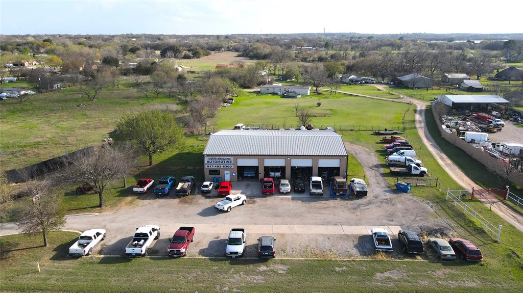 Excellent location for your business!  FM 1187 is the I-20 of the South, providing East-West access for the Southern Metroplex. This property lies midway between Mansfield and Burleson. 
This 4,160 sf building sits on 1.08 acres and includes an office, bathroom,  4 working bays in the front and 4 working bays in the back. This property also includes spacious parking, the back half is fenced with a gate that locks for security. 
The seller is willing to sell separately the five lifts and air compressor.
No sign on property, this is a working business.