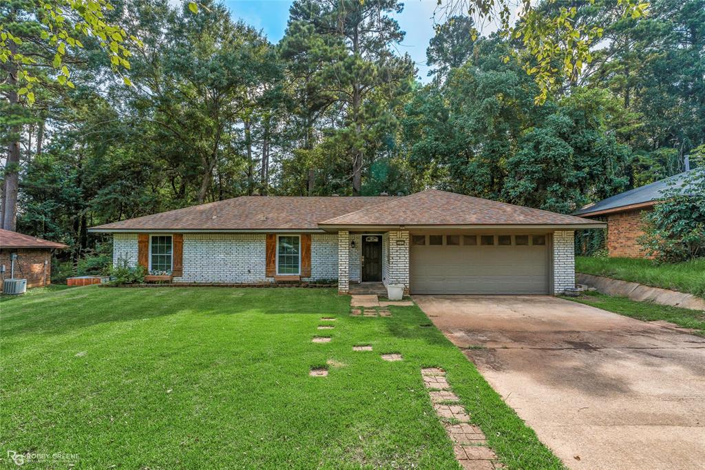 Lovely brick home with modern touches throughout nestled in the Dogwood Park neighborhood! The vaulted ceiling with beam accents in the spacious living room offer an open and airy atmosphere while the brick fireplace and wood floors bring character and charm. The kitchen and dining area flow from the living room, making this floorplan perfect for entertaining. With ample cabinet space, granite counters, and modern appliances, the kitchen is sure to make meal prep a breeze. The relaxing primary suite provides a nice retreat after a long day while the ensuite bath offers privacy and convenience. The additional two bedrooms each have great storage space and share a full bath, perfect for guests and family. The backyard is sure to impress with a covered patio and large wood deck providing ample space to host gatherings or simply enjoy time outside. Conveniently located near I220, BAFB, and local shopping and dining, this home might just be perfect to fit your needs. Don't wait, schedule a showing today!