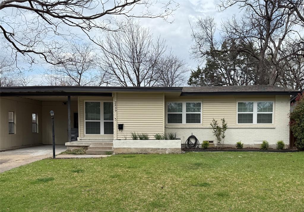 Beautifully updated four bedroom with new golden oak laminate flooring and carpet in bedrooms. New cabinets in kitchen with new stainless appliances. Fresh paint throughout. Updated windows and bathrooms. Recessed lighting and more. A must see! Agent is principal in the company that owns this property.