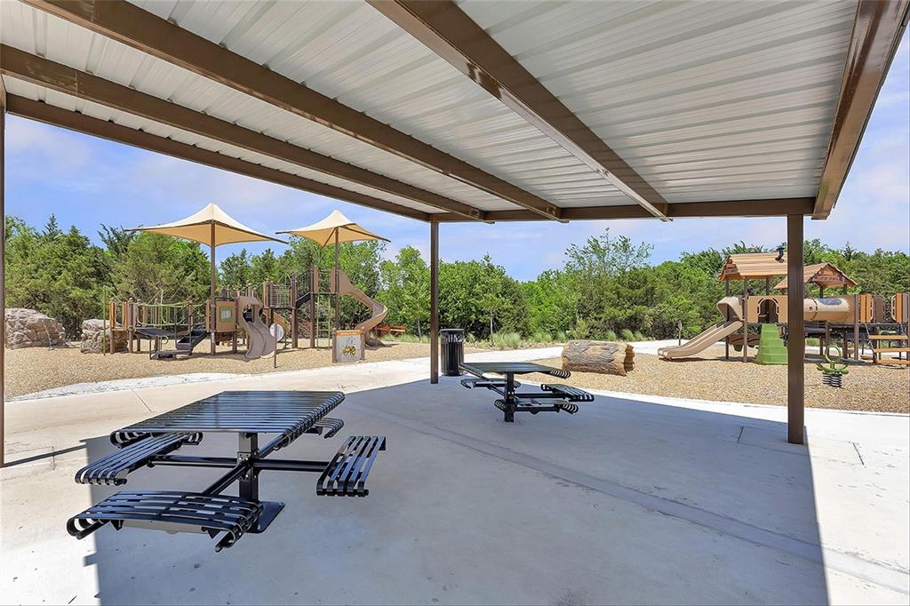 MLS# 20380143 - Built by UnionMain Homes - Ready Now! ~ Welcome to this exceptional 2-story home, encompassing 3,297 sq ft of luxury living space. This stunning property boasts 4 beds, 3.5 baths, and a 2-car rear entry garage, providing both convenience and style. The upgraded gourmet kitchen is a chef's delight, featuring top-of-the-line appliances and exquisite finishes. Experience the seamless flow of open living areas, perfect for entertaining and creating cherished memories. Gorgeous hardwood flooring throughout the main living areas. Gather around the enchanting stone fireplace or enjoy the outdoors through the triple sliding door leading to the extended patio. The media room and game room offer additional spaces for entertainment and relaxation. Retreat to the primary bath, complete with a tub, shower, and double sinks, creating a luxurious oasis. This home exemplifies comfort and sophistication.