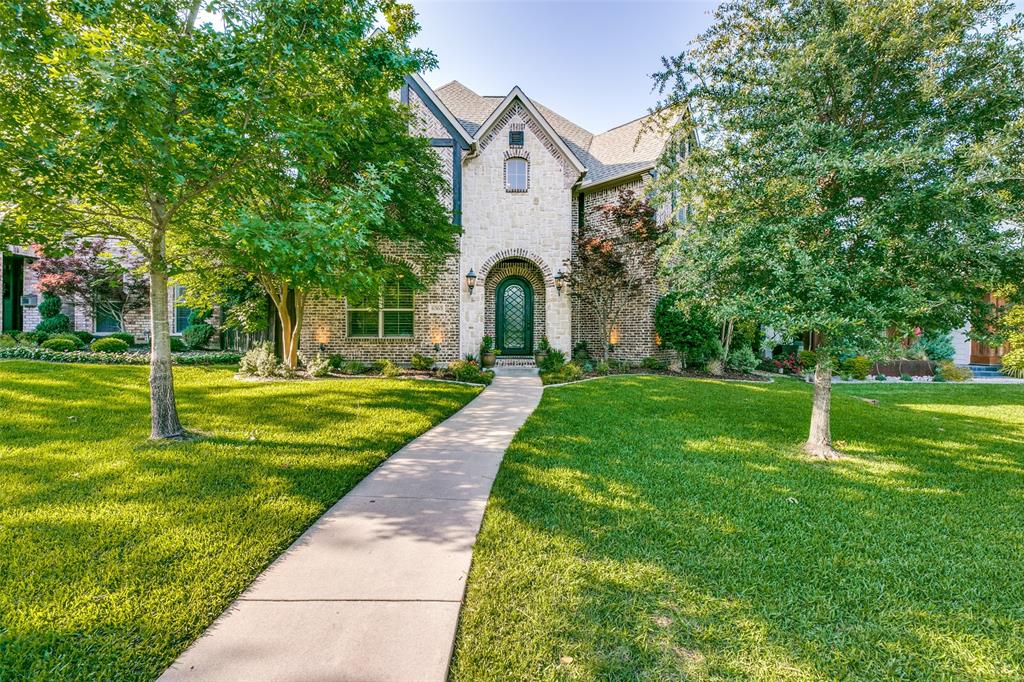 Come see this spectacular family home on an expansive 220' deep lot.  This beautifully built modern Tudor features hardwood floors throughout, tall ceilings and an expansive living space built for the modern family.  The professional kitchen boasts Sub-Zero fridge, Wolf cooktop, dual Thermador ovens and granite counters.  Adjacent to the living area is a wet bar with wine cooler and ice maker; an adjoining closet was converted into toy storage for the kids, but could easily be changed back into the original Wine Closet.  Downstairs Study is accented with a beautiful wooden coffered ceiling and great view of the yard.  Primary Suite is separated from the other bedrooms with a spacious bath and large walk in closet.  Downstairs Mother in Law suite is great for guests or as a second office.  Large lot is perfect for the kids and entertaining; there is a built in gas grill, an outdoor fireplace and plumbing for gas heaters; making the outdoor living space usable all year long.  Plenty of room to add a pool.  Detached garage has a recently renovated ~400sqft guest suite with kitchenette and full bath (not included in home's sq footage).  Garage has professional epoxy flooring, lots of storage, 220V outlet for charging and an electric gate. Located in the award winning Mockingbird Elementary district, close to Lakewood Country Club and all that Lower Greenville and Lakewood have to offer.