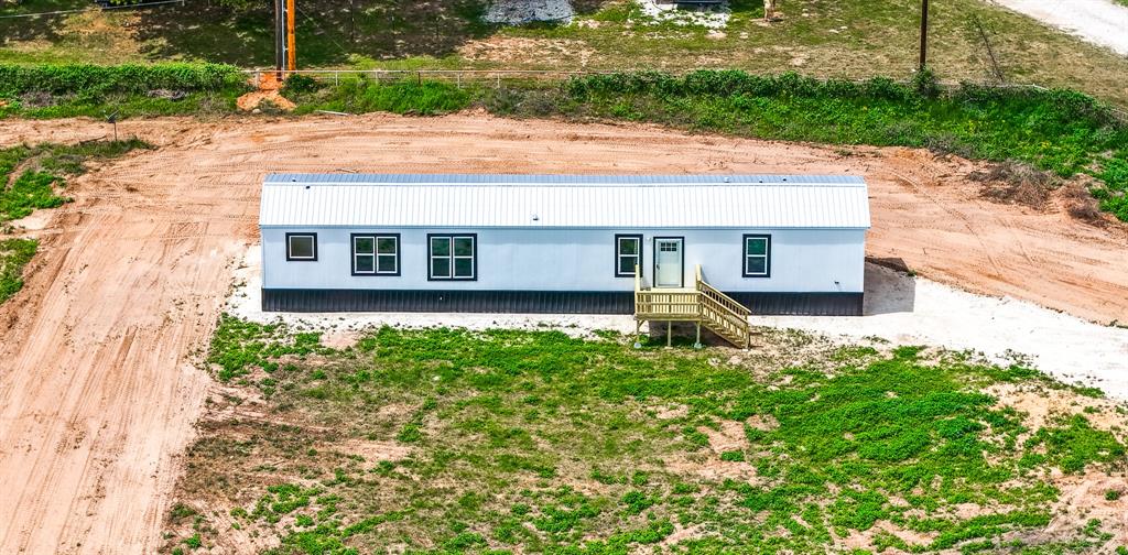 Experience the ultimate blend of modern living and rural freedom in this brand-new, 3-bedroom, 2-bathroom home perfectly situated on .67 unrestricted acres. Located along the convenient Hwy 14 corridor between Groesbeck and Mexia, this property offers the rare opportunity to enjoy a fresh, contemporary interior while maintaining the liberty to use your land exactly how you wish—whether that means building a workshop, starting a garden, or simply enjoying the Texas sunset. The home features a bright, open-concept layout and a spacious primary suite, all nestled on a generous lot that provides plenty of elbow room without sacrificing proximity to local amenities. This is a turnkey opportunity for anyone seeking a peaceful, private lifestyle with no HOA or restrictions to hold them back.