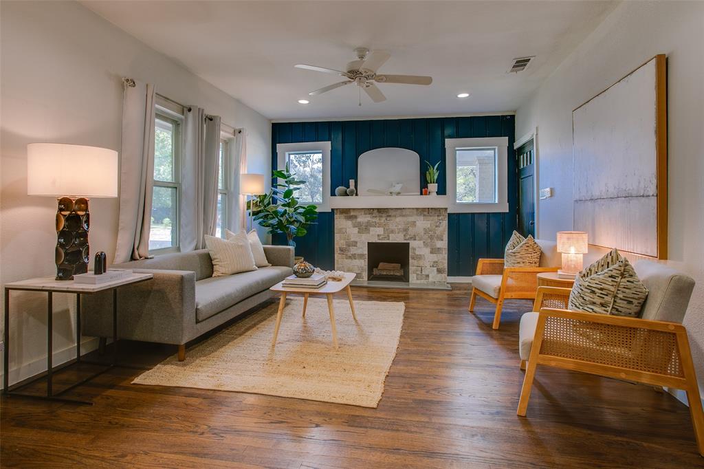 A home as charming as this one is hard to come by. Tucked away in the heart of Kessler Plaza, this beautifully remodeled bungalow strikes the perfect balance of historic character and modern sophistication. From the moment you step inside, you’re greeted with gleaming hardwood floors, thoughtful updates, and a seamless, open layout that invites you to linger.

The living room is anchored by a striking accent wall and updated fireplace that effortlessly set the tone for the rest of the home. Flowing naturally into the dining and kitchen areas, you’ll find a crisp white color palette complemented by quartz countertops, stainless steel appliances, and an abundance of cabinetry bathed in soft natural light. Just beyond, a flexible bonus space overlooking the backyard makes the ideal home office, studio, or reading nook.

Each bedroom is generous in size, with the primary suite featuring a walk-in closet and spa-like bath complete with bold patterned tile, double vanities, and statement mirrors. Outside, the spacious fenced yard provides endless possibilities, whether it’s hosting under the trees, planting a garden, or expanding your outdoor living.

Perfectly positioned near Bishop Arts, Kiest Park, and Stevens Park Golf Course, this gem delivers the best of Oak Cliff living, offering style, comfort, and a sense of home you’ll feel the moment you walk through the door.